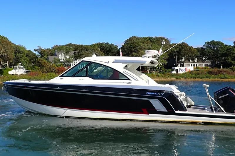  Yacht Photos Pics 2022 Formula 380 Super Sport Crossover OB boat cruising on a sunny day.