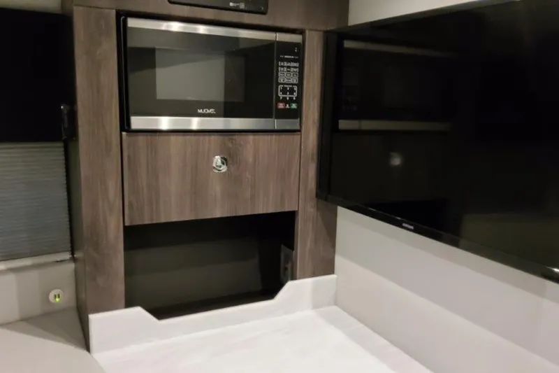  Yacht Photos Pics 2022 Formula 380 Super Sport Crossover OB interior with microwave and TV.