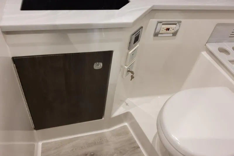  Yacht Photos Pics 2022 Formula 380 Super Sport Crossover OB bathroom interior with modern fixtures and cabinetry.