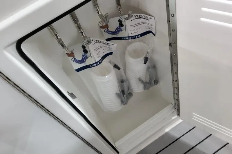  Yacht Photos Pics Storage compartment in 2022 Formula 380 Super Sport Crossover OB with organized accessories.