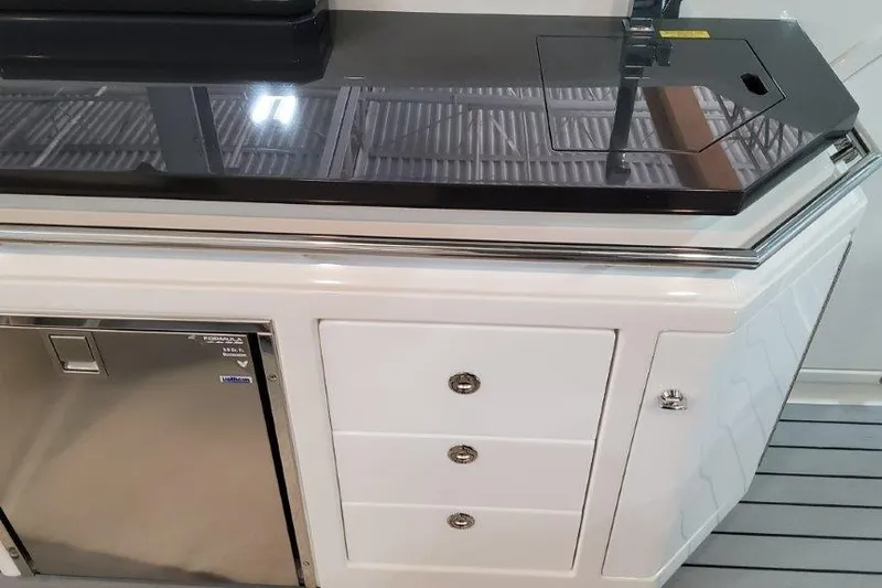  Yacht Photos Pics 2022 Formula 380 Super Sport Crossover OB interior with sleek cabinetry and grill.