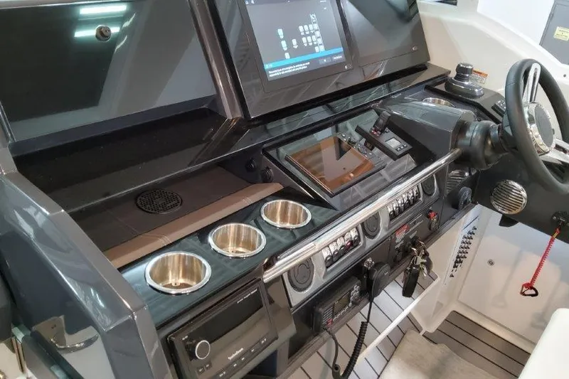  Yacht Photos Pics 2022 Formula 380 Super Sport Crossover OB dashboard with modern controls and touchscreen display.