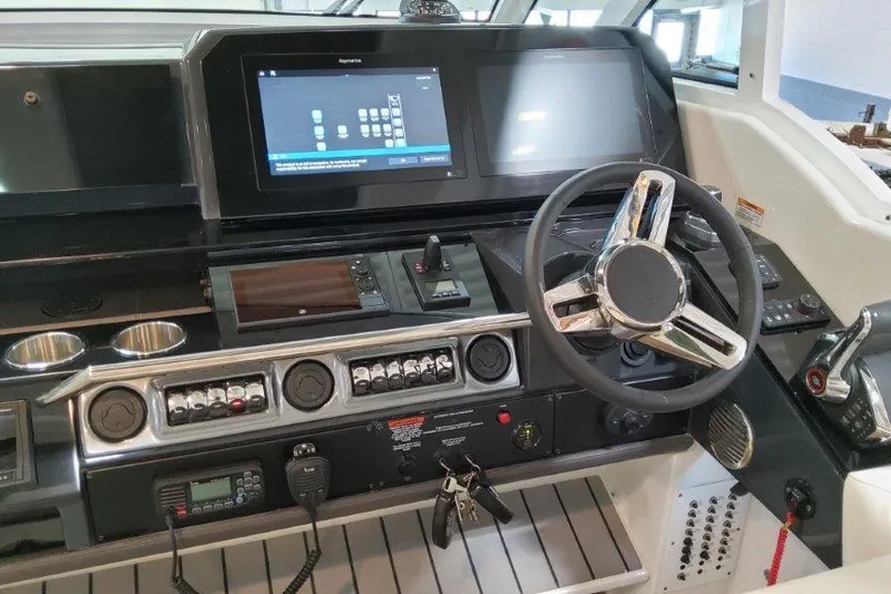  Yacht Photos Pics 2022 Formula 380 Super Sport Crossover OB dashboard with modern controls and steering wheel.