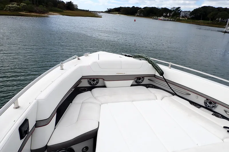  Yacht Photos Pics 2022 Formula 380 Super Sport Crossover OB boat on calm water, featuring luxurious seating.