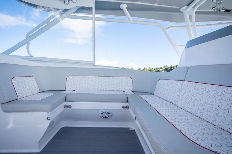 Patti Anne Yacht Photos Pics Luxurious seating area on 2022 Intrepid 409 Valor boat, featuring stylish upholstery and modern design.