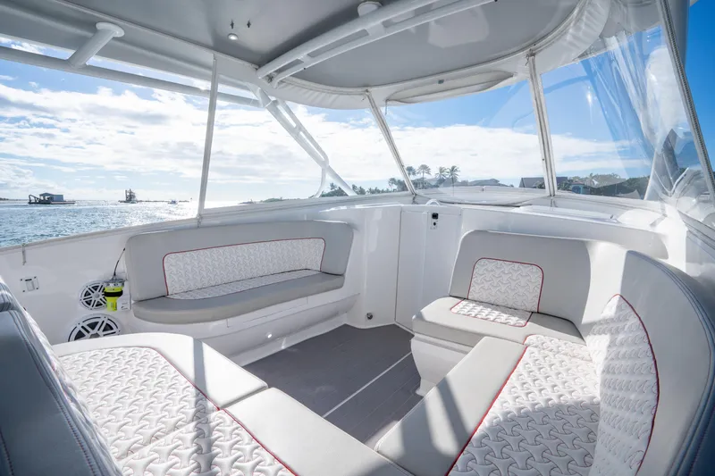 Patti Anne Yacht Photos Pics Luxurious interior of 2022 Intrepid 409 Valor boat with comfortable seating and ocean view.