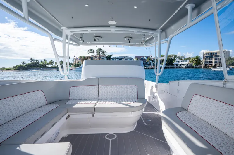 Patti Anne Yacht Photos Pics Luxurious 2022 Intrepid 409 Valor boat interior with elegant seating and ocean view.