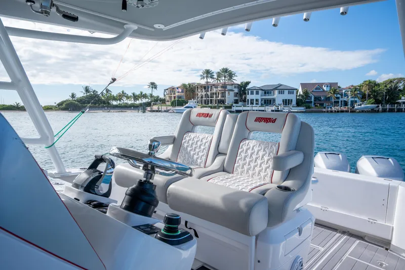 Patti Anne Yacht Photos Pics 2022 Intrepid 409 Valor boat interior with luxury seating and waterfront view.