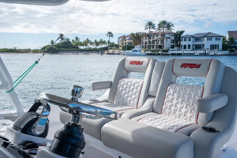 Patti Anne Yacht Photos Pics 2022 Intrepid 409 Valor boat interior with luxury seating and scenic waterfront view.