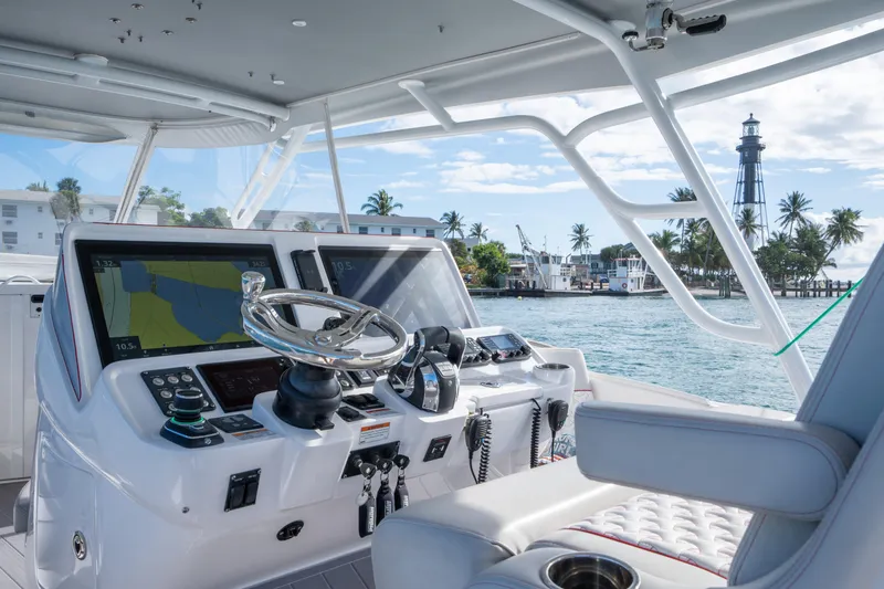 Patti Anne Yacht Photos Pics 2022 Intrepid 409 Valor yacht helm with navigation screens and ocean view.