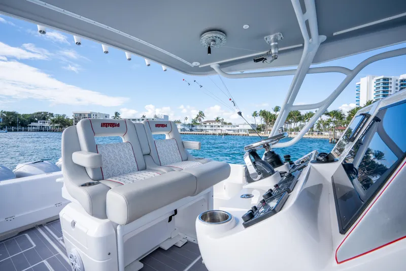 Patti Anne Yacht Photos Pics 2022 Intrepid 409 Valor boat interior with luxurious seating and modern controls.