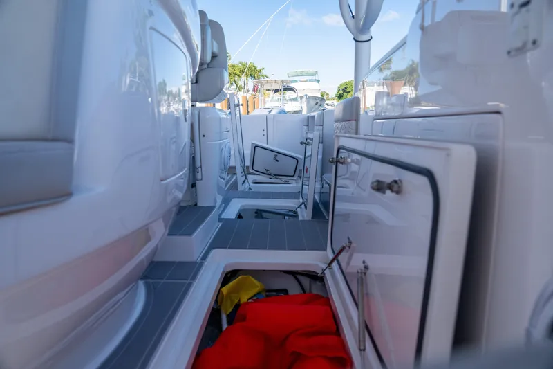 Patti Anne Yacht Photos Pics 2022 Intrepid 409 Valor boat interior with open storage compartments and visible equipment.