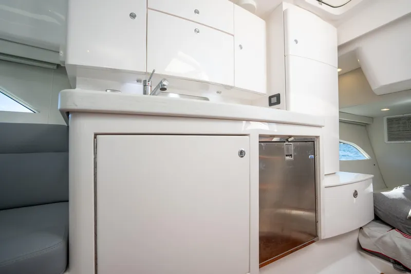 Patti Anne Yacht Photos Pics Modern kitchen interior on 2022 Intrepid 409 Valor yacht, featuring sleek cabinetry and stainless steel appliances.