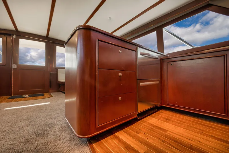 Decoy Yacht Photos Pics Interior of 2002 Paul Mann 60 Custom Carolina yacht with wooden cabinetry and panoramic windows.