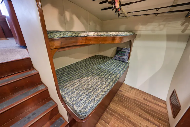 Decoy Yacht Photos Pics Bunk beds in 2002 Paul Mann 60 Custom Carolina yacht with fishing rods overhead.