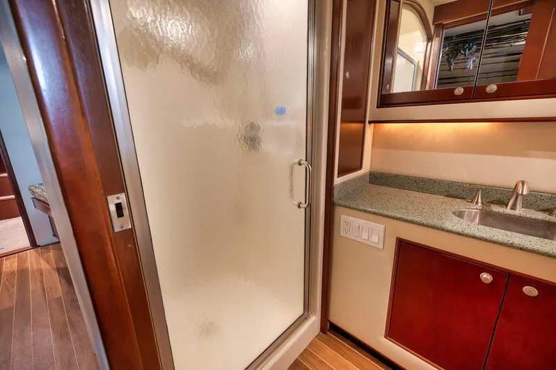Decoy Yacht Photos Pics Luxurious bathroom interior of 2002 Paul Mann 60 Custom Carolina yacht with shower and sink.