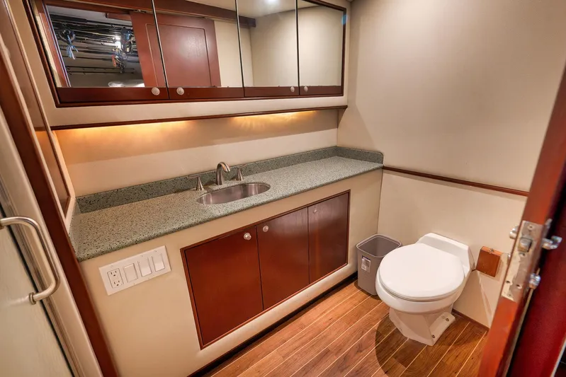 Decoy Yacht Photos Pics Luxurious bathroom in 2002 Paul Mann 60 Custom Carolina yacht with wood flooring and modern fixtures.