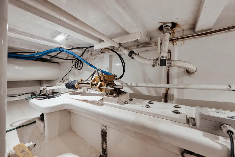 Decoy Yacht Photos Pics Engine room of 2002 Paul Mann 60 Custom Carolina boat, showing mechanical components and piping.