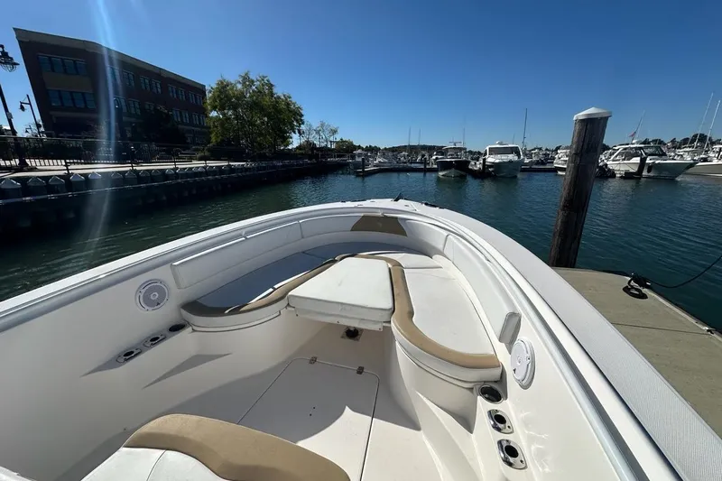  Yacht Photos Pics 2015 Edgewater 320CC boat docked at marina under clear blue sky.