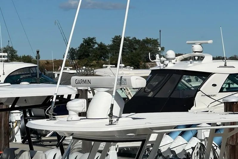  Yacht Photos Pics Boats docked at marina, featuring 2015 Edgewater 320CC with Garmin equipment.