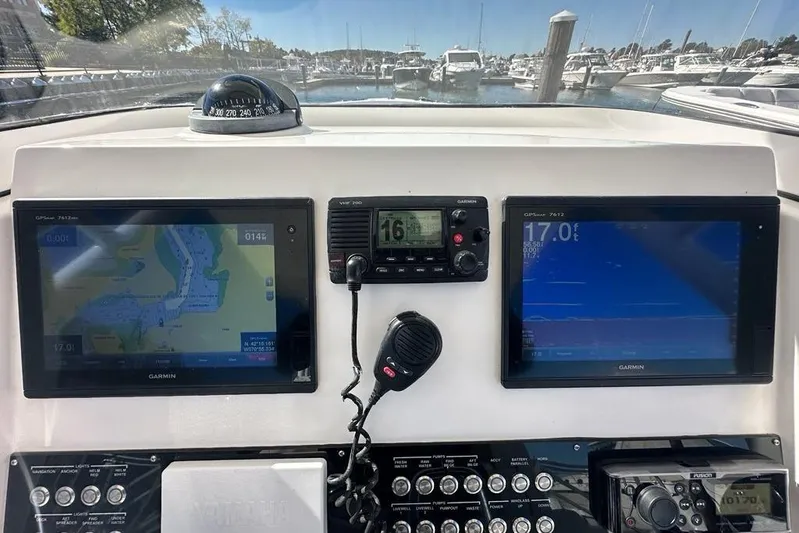  Yacht Photos Pics Dashboard of a 2015 Edgewater 320CC boat with Garmin navigation displays.