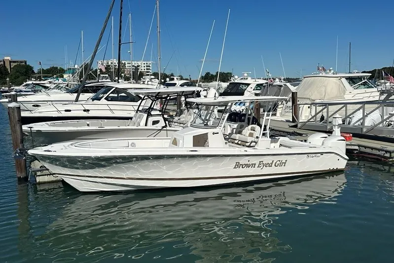  Yacht Photos Pics 2015 Edgewater 320CC boat named "Brown Eyed Girl" docked in a marina.