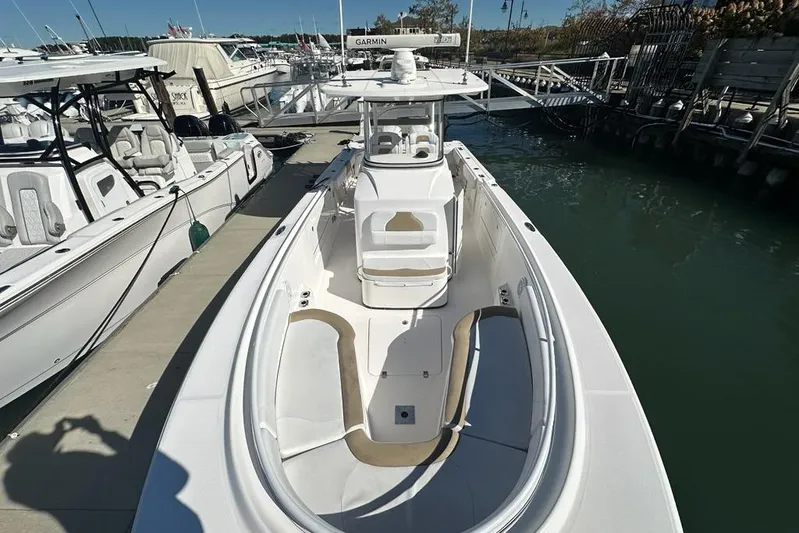  Yacht Photos Pics 2015 Edgewater 320CC boat docked at marina, featuring spacious deck and modern design.