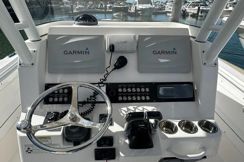  Yacht Photos Pics Control panel of 2015 Edgewater 320CC boat with Garmin navigation system.