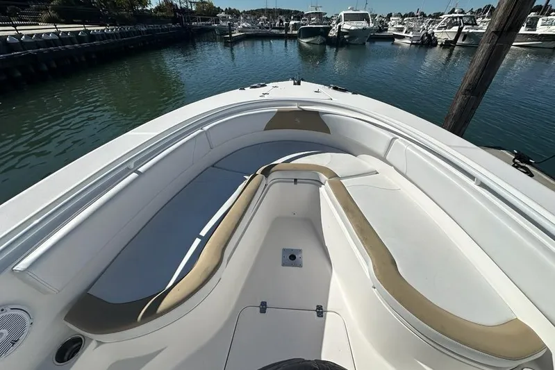  Yacht Photos Pics 2015 Edgewater 320CC boat interior with spacious seating at marina.