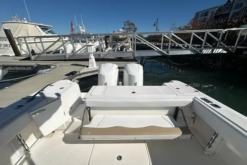  Yacht Photos Pics 2015 Edgewater 320CC boat docked at marina with dual engines and seating area.