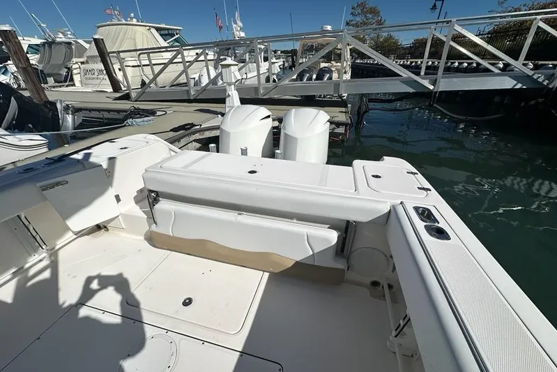  Yacht Photos Pics 2015 Edgewater 320CC boat docked at marina with dual outboard engines.