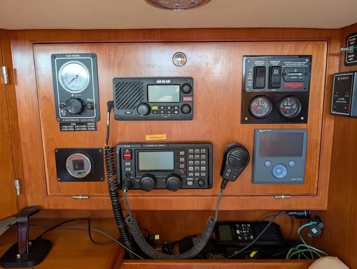 Ubiquitous Yacht Photos Pics Control panel of a 2015 Outbound 46 yacht with navigation and communication equipment.