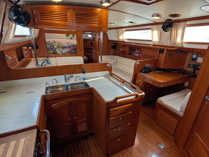 Ubiquitous Yacht Photos Pics Luxurious 2015 Outbound 46 yacht interior with wood finish and modern amenities.