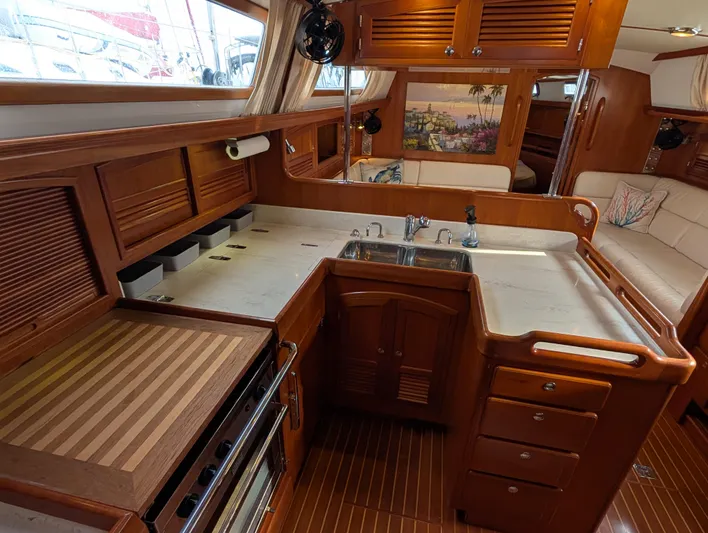 Ubiquitous Yacht Photos Pics Luxurious 2015 Outbound 46 yacht interior with elegant wood cabinetry and modern kitchen amenities.