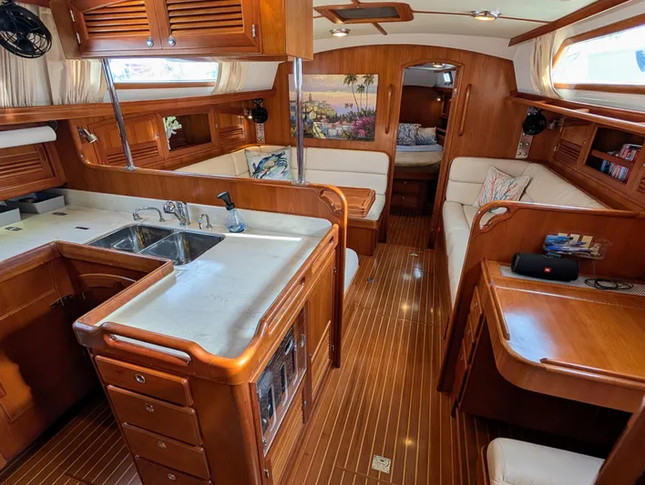 Ubiquitous Yacht Photos Pics Luxurious 2015 Outbound 46 yacht interior with wood finish and modern amenities.