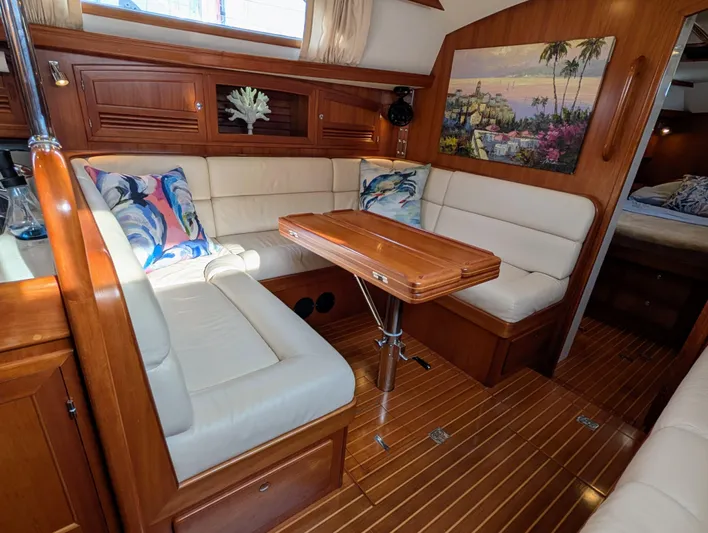 Ubiquitous Yacht Photos Pics Luxurious interior of 2015 Outbound 46 yacht with elegant wood finish and cozy seating.