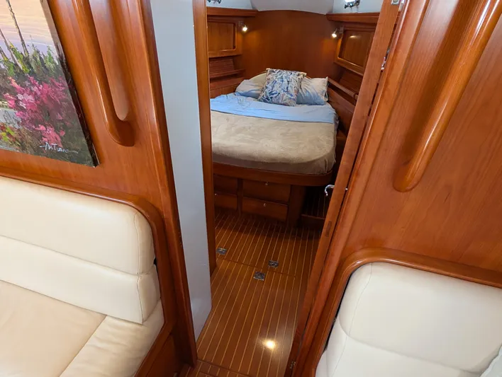 Ubiquitous Yacht Photos Pics Luxurious cabin interior of 2015 Outbound 46 yacht with wood finish and cozy bed.