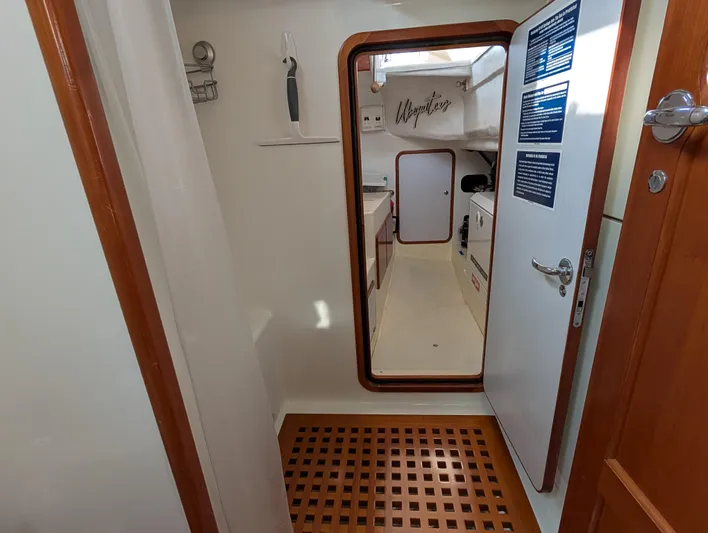 Ubiquitous Yacht Photos Pics Interior of 2015 Outbound 46 yacht, featuring a compact, well-lit cabin space.