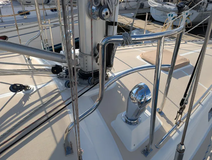 Ubiquitous Yacht Photos Pics Deck of 2015 Outbound 46 sailboat with polished metal fittings and rigging.