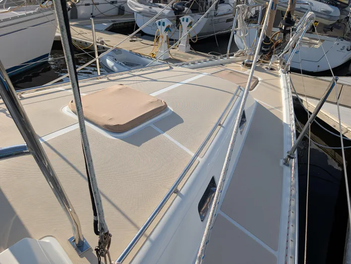 Ubiquitous Yacht Photos Pics Sailboat deck of 2015 Outbound 46, docked at marina with visible rigging and hatches.