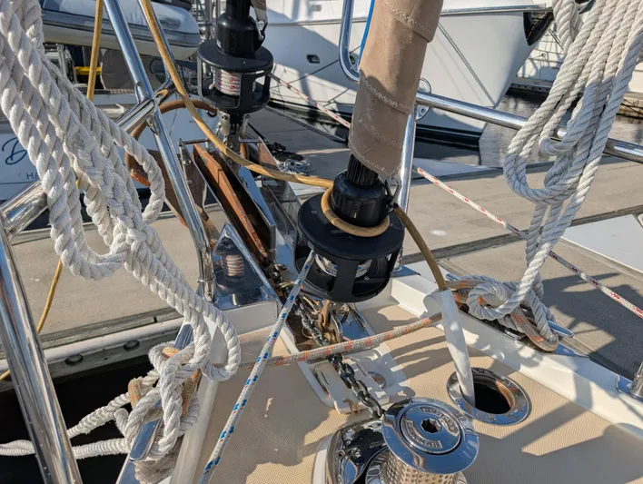 Ubiquitous Yacht Photos Pics Sailing yacht rigging on a 2015 Outbound 46, featuring ropes and winches at the bow.