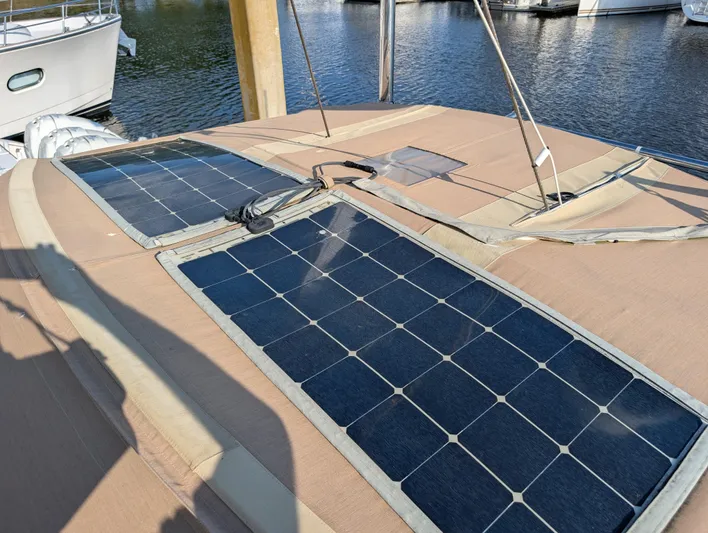 Ubiquitous Yacht Photos Pics Solar panels on 2015 Outbound 46 yacht deck, docked at marina.