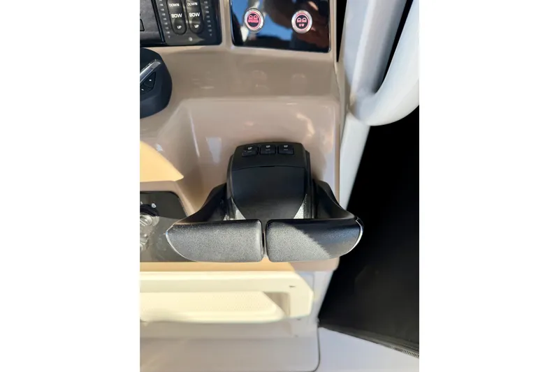 Da Kine Yacht Photos Pics 2022 Robalo R272 Center Console throttle controls on boat dashboard.