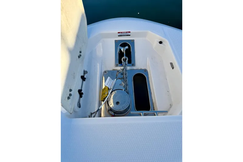 Da Kine Yacht Photos Pics 2022 Robalo R272 Center Console anchor compartment with winch and chain.