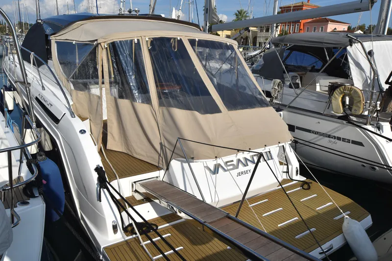 Vasanti Ll Yacht Photos Pics 2023 Azimut Atlantis 45 yacht docked Corfu, Gouvia marina with beige canopy.