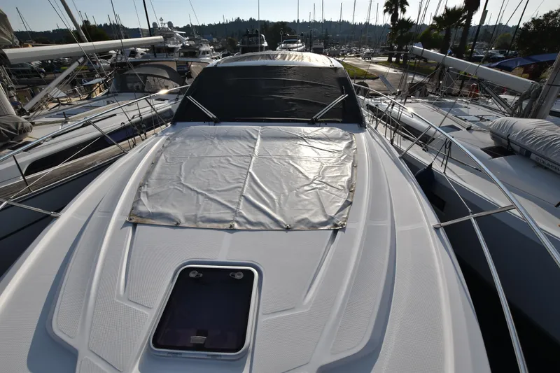 Vasanti Ll Yacht Photos Pics 2023 Azimut Atlantis 45 yacht docked at marina, showcasing sleek deck design.
