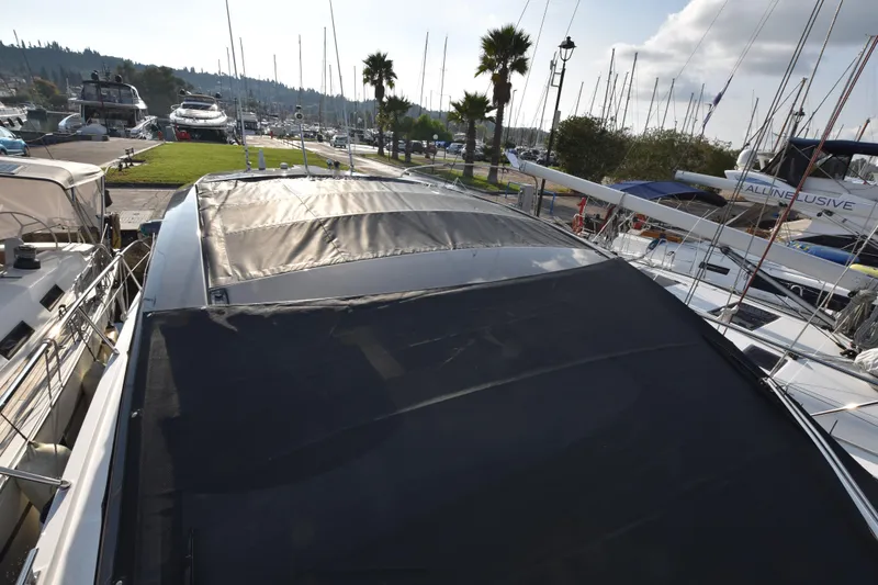 Vasanti Ll Yacht Photos Pics Azimut Atlantis 45 sports boat, 2023, docked at Greece, Crofu marina with surrounding boats.