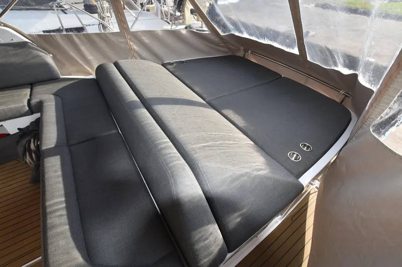 Vasanti Ll Yacht Photos Pics Luxurious seating area on 2022 Azimut Atlantis 45 yacht, featuring sleek gray upholstery.