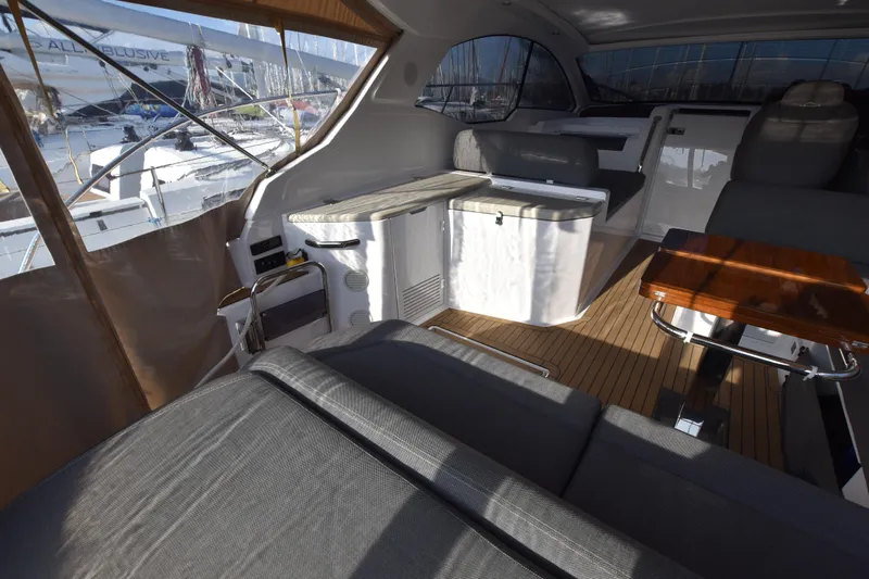 Vasanti Ll Yacht Photos Pics Interior of 2023 Azimut Atlantis 45 yacht with modern seating and wooden flooring.