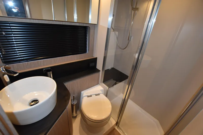 Vasanti Ll Yacht Photos Pics Luxurious bathroom in 2023 Azimut Atlantis 45 motor boat with modern fixtures and shower.